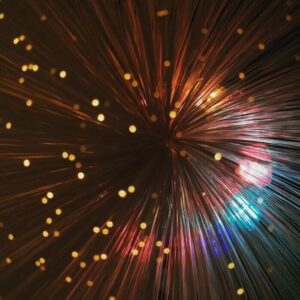 Abstract background with multicolored beams and bokeh effect